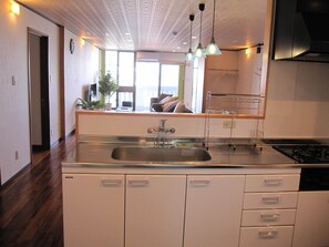 Deluxe Room, 2 Bedrooms, Non Smoking, Partial Ocean View (202) | Private kitchen | Full-size fridge, microwave, stovetop, rice cooker - Hibisu yabu (Nago)