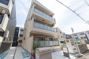 Stylish building with large windows and a contemporary entrance.