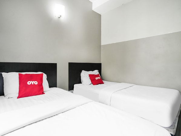 Habitación Deluxe con 2 camas individuales | Escritorio, wifi gratis y ropa de cama 