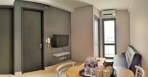 8-AD, 2 Bedroom Apartment | Living area | 21-inch flat-screen TV with cable channels, LED TV - Lovina at One Residence (Batam)