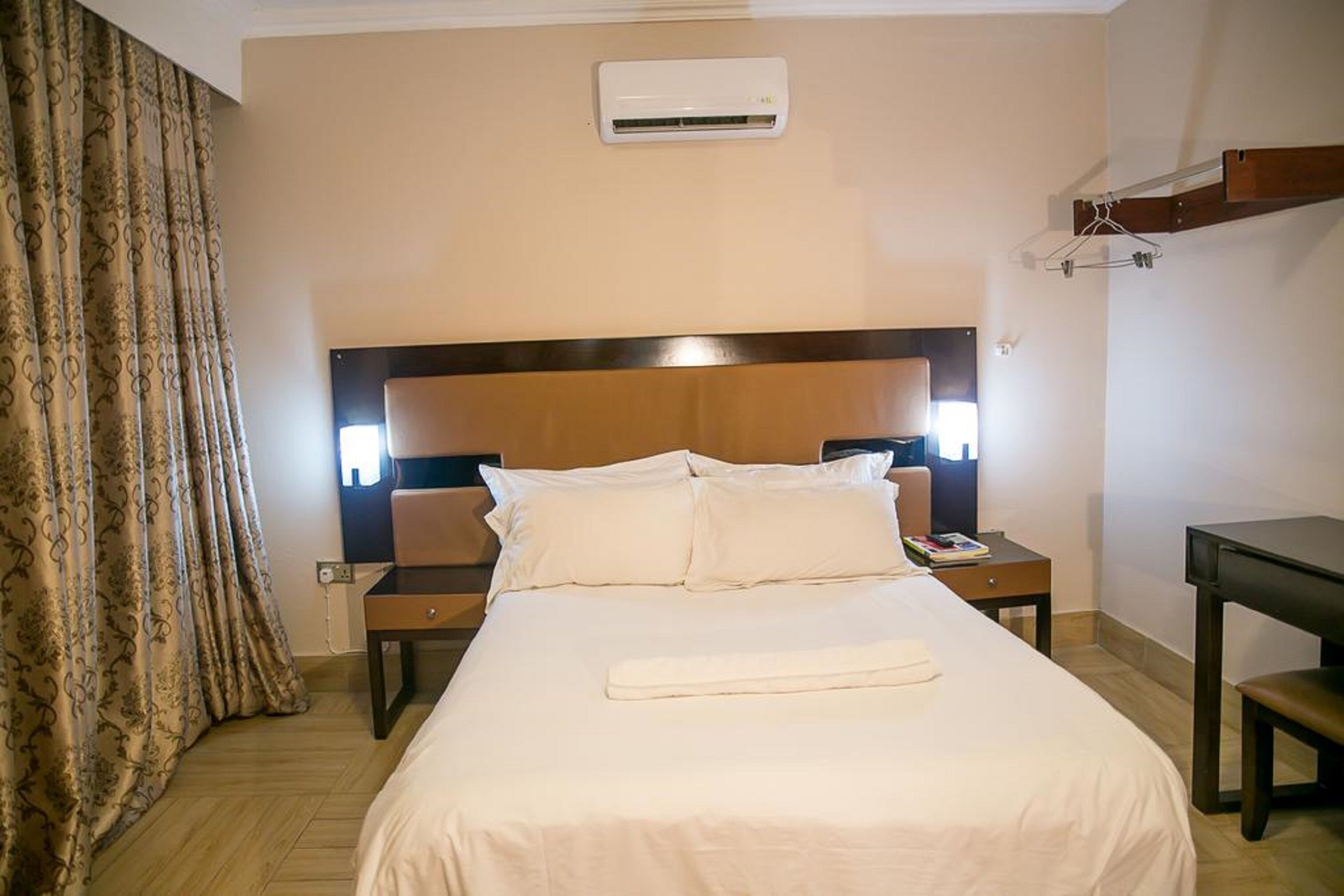 Premium bedding, desk, laptop workspace, iron/ironing board