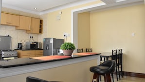 Standard Apartment, 2 Bedrooms | Private kitchenette | Full-size fridge, microwave, oven, stovetop - Acacia Luxurious Apartments (Nairobi)