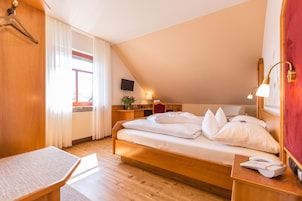 Hypo-allergenic bedding, down duvets, desk, laptop workspace