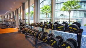 A gym with rows of dumbbells and treadmills. - Yemala Suites @ Vortex KLCC (Kuala Lumpur)