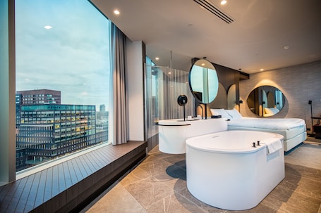 Suite, 1 King Bed, Hot Tub | 1 bedroom, in-room safe, blackout drapes, iron/ironing board