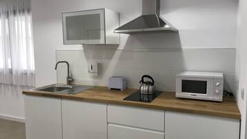 Fridge, microwave, stovetop, coffee/tea maker