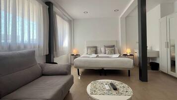 Family Studio, Multiple Beds | Living area | 32-inch flat-screen TV with satellite channels