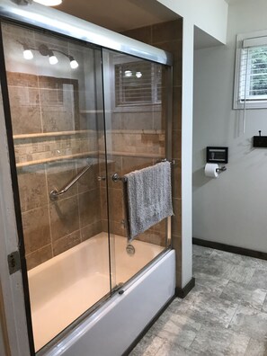 Combined shower/tub, hair dryer, towels, toilet paper