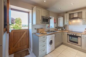 Cottage, 2 Bedrooms (Duck) | Private kitchen | Full-size fridge, microwave, oven, stovetop