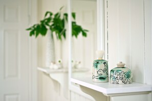 A bathroom vanity with a white sink and a mirror. - House of the Snowbird (Reykjavik)