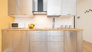 City Apartment | Private kitchen | Coffee/tea maker, fridge, microwave, stovetop - Residence Delle Erbe by Studio Vita (Bologna)