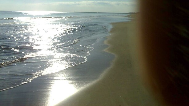 A beach with a sandy shore and gentle waves. - DUPLEX PENTHOUSE APARTMENT in Isla Cristina. (Isla Cristina)