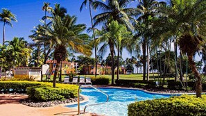 Outdoor pool, open 7:00 AM to 10:00 PM, pool loungers