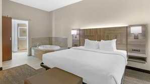 A modern hotel room with a large bed, a built-in bathtub, and a separate shower area. - Best Western Plus Executive Residency Phoenix North Happy Valley (Phoenix)