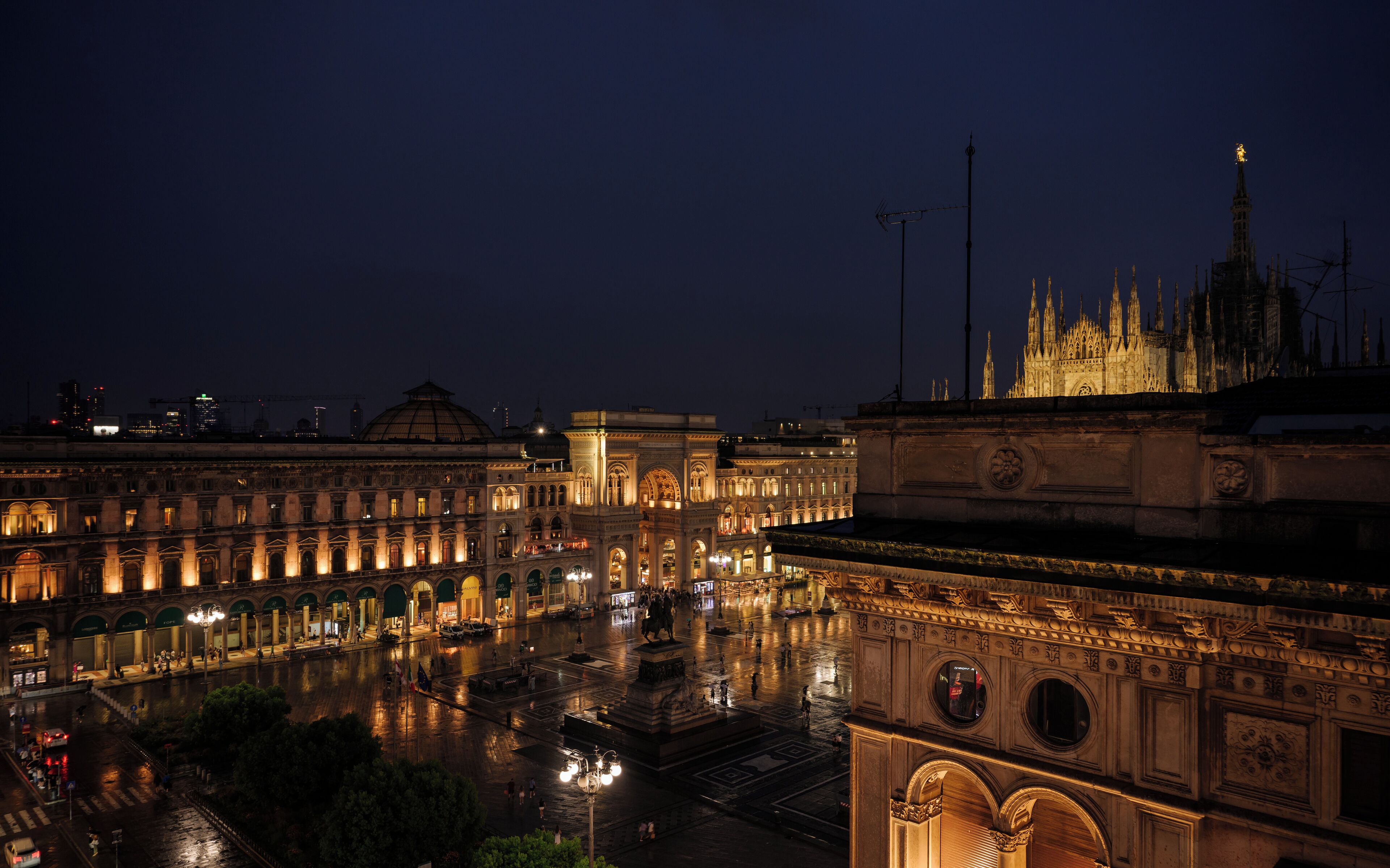 A historic building with classical architecture, including arched windows and detailed stonework.