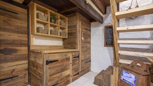 A rustic wooden interior with built-in shelves and a chalkboard menu. - An Authentic Chalet near the cable car in Saint-gervais-les-bains (Saint-Gervais-Les-Bains)