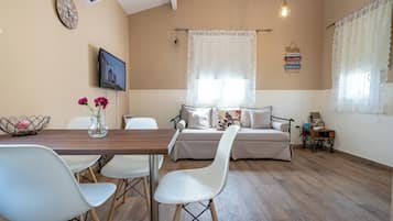 Family Bungalow, 1 Bedroom | Living area | 28-inch Smart TV with digital channels, TV