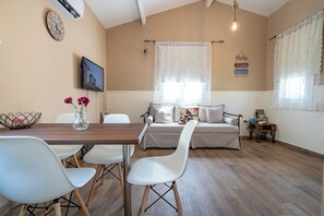 Family Bungalow, 1 Bedroom | Living area | 28-inch Smart TV with digital channels, TV - Olympia's Apartments (Spata-Artemida)