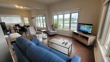 Panoramic Suite, 1 Bedroom, Sea View | Living area | 15-inch TV with digital channels