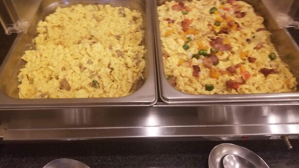 Two buffet trays with scrambled eggs and bacon. - Cotulla Whitten Inn (Cotulla)