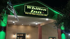 The exterior of the Whitten Inn with a prominent sign and entrance. - Cotulla Whitten Inn (Cotulla)
