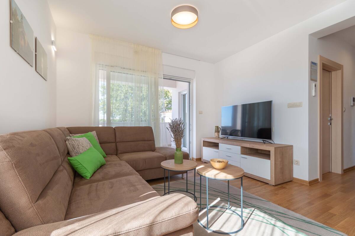 Apartment, 2 Bedrooms (Sita) | Living area | Flat-screen TV, fireplace