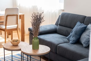 Apartment, 2 Bedrooms (More) | Living area | Flat-screen TV, fireplace