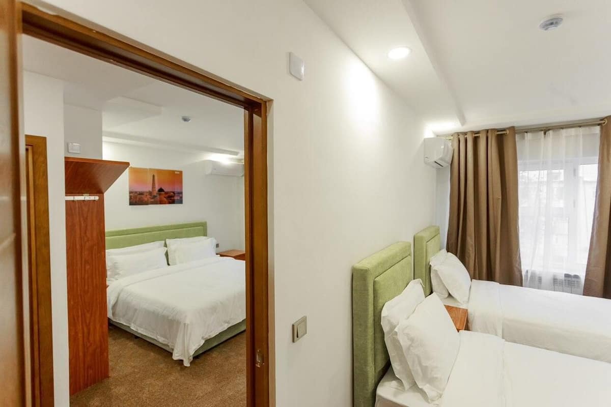 Classic Quadruple Room | Premium bedding, desk, laptop workspace, WiFi (free)