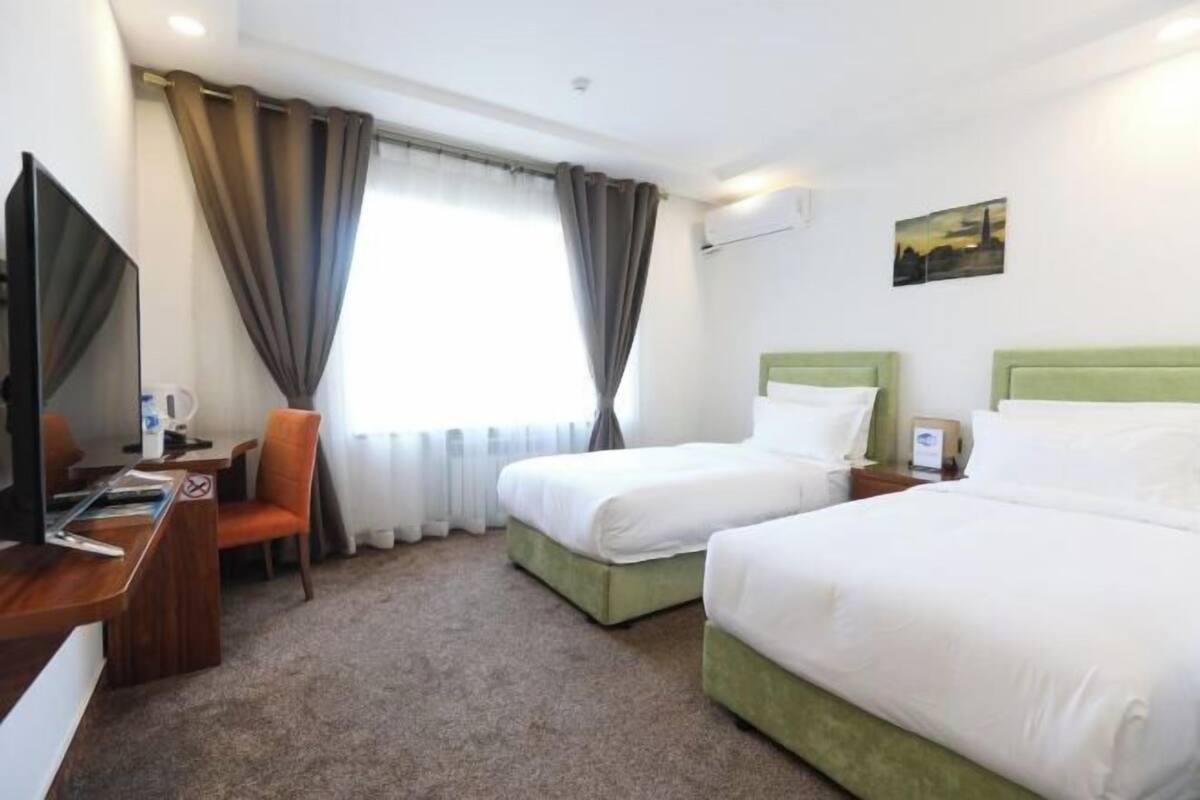 Premium bedding, desk, laptop workspace, free WiFi