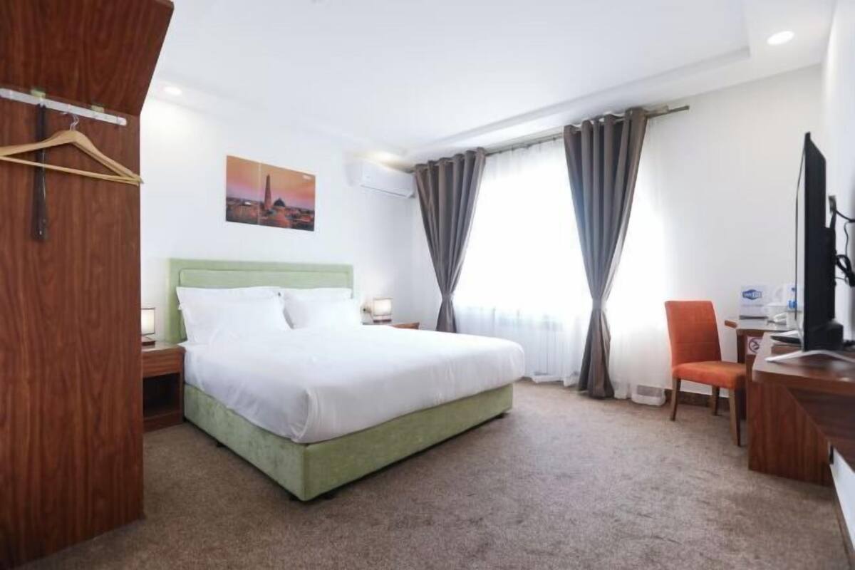Premium bedding, desk, laptop workspace, free WiFi