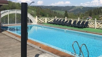 Seasonal outdoor pool, pool umbrellas, pool loungers