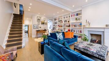 TV, fireplace, books