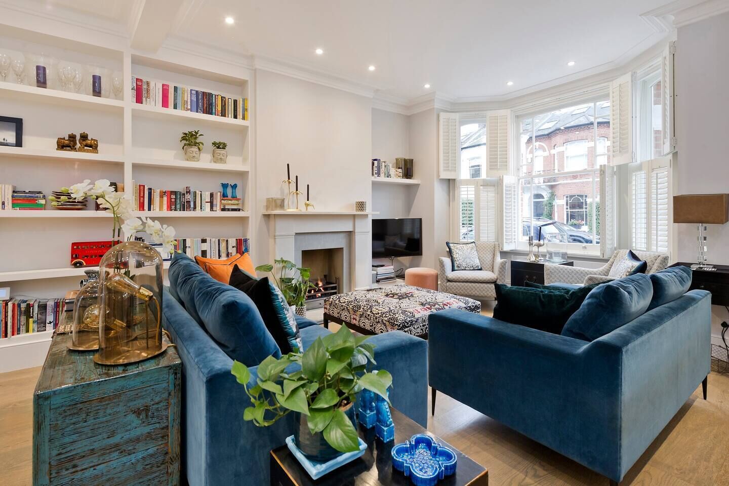 TV, fireplace, books