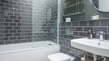 Combined shower/bathtub, hair dryer, towels, soap