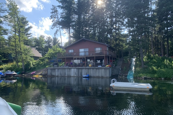 view from the lake with waterslide.
