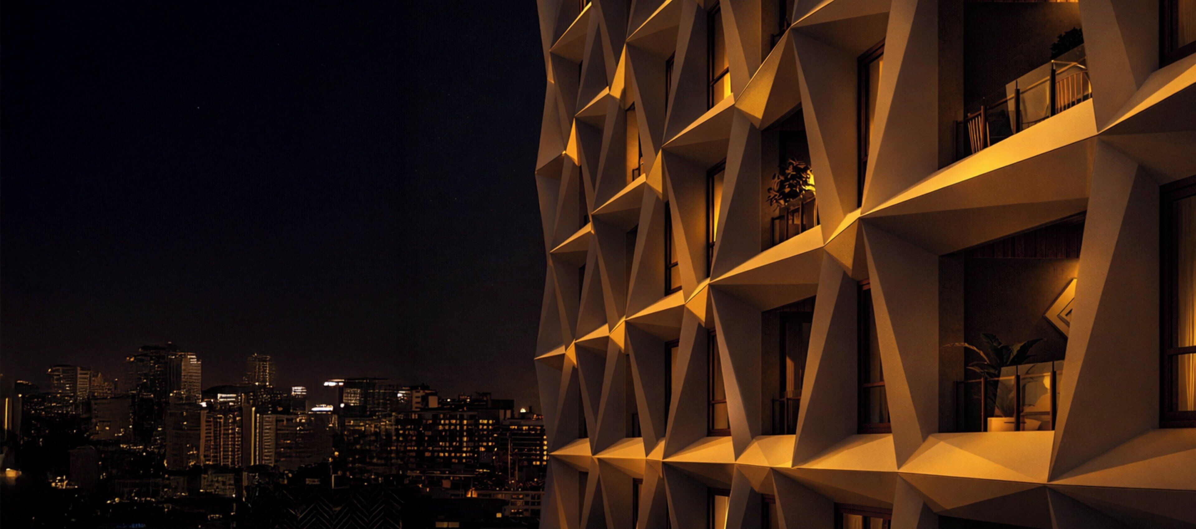 A modern building with a geometric facade and multiple balconies.