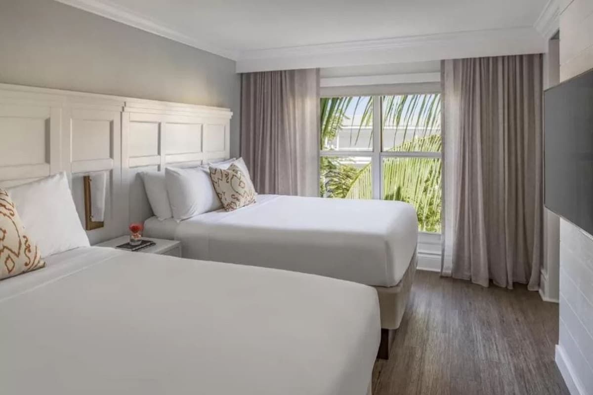Hypo-allergenic bedding available, down comforters, in-room safe