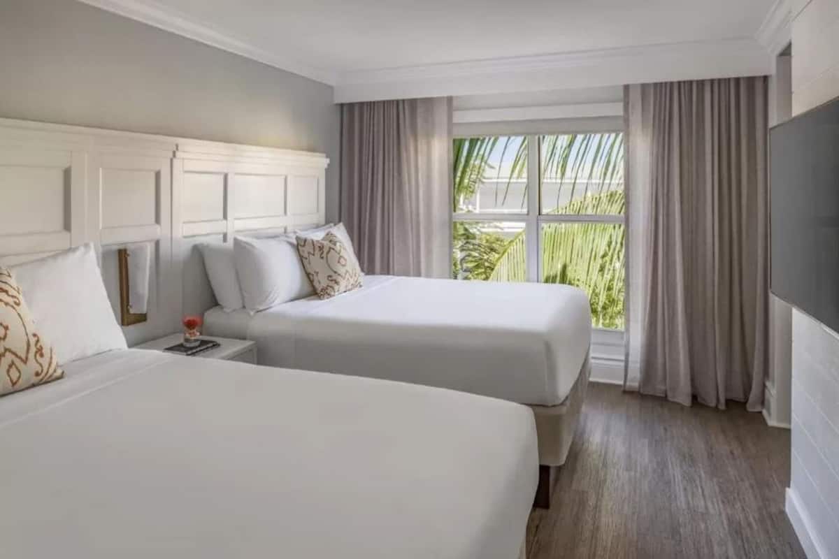 Hypo-allergenic bedding available, down comforters, in-room safe