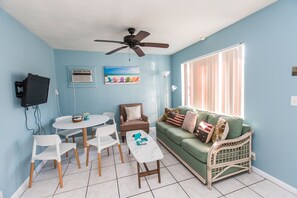 Apartment, 1 Bedroom, Non Smoking (Beachlife Deluxe - 5 min to beach) | Living room | Flat-screen TV - Fairway Getaway (Fort Myers Beach)