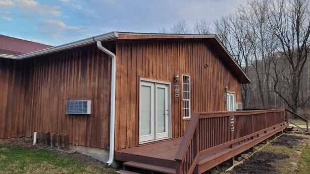 A wooden building with a porch and steps leading to a door. - Cowboy Guest Suite | Near Trails, Events & Music Barn 1BR, 1BA (Nashville)