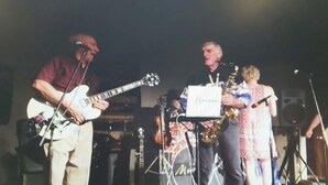 A band performing on stage with musical instruments and a microphone stand. - Cowgirl Guest Suite | Near Trails, Events & Music Barn 1BR, 1BA (Nashville)
