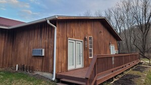 A wooden building with a porch and steps leading to a door. - Cowgirl Guest Suite | Near Trails, Events & Music Barn 1BR, 1BA (Nashville)