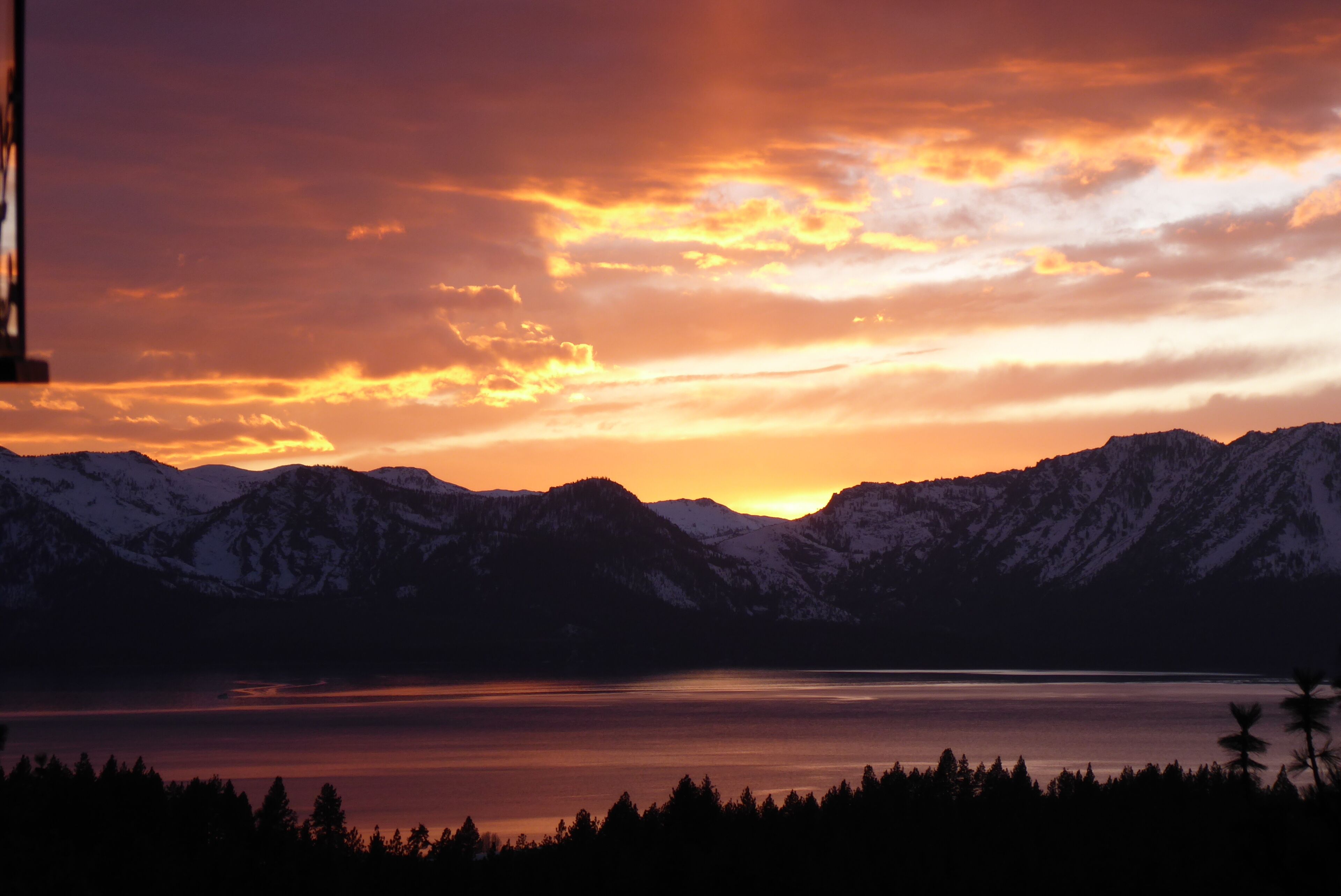 Sunset shoreline views from the great room and deck. Breathtakingly picturesque.