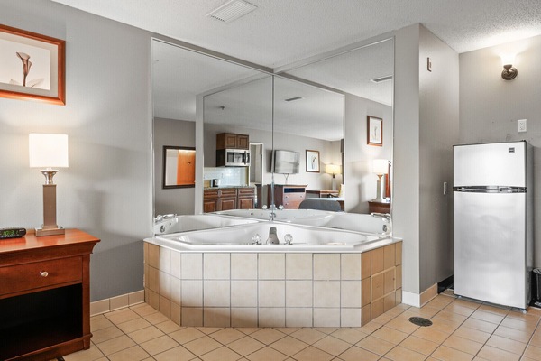 Standard Suite, 1 King Bed, Kitchen (Jetted Tub) | Blackout drapes, iron/ironing board, WiFi (free), bed sheets