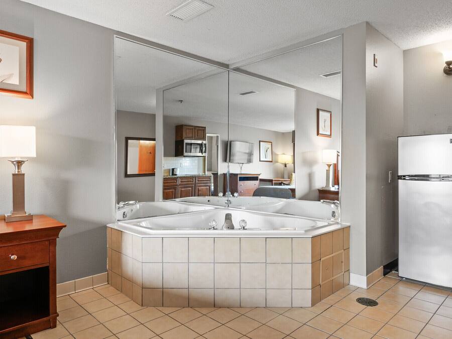 Standard Suite, 1 King Bed, Kitchen (Jetted Tub) | Blackout curtains, iron/ironing board, free WiFi, bed sheets