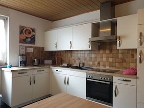 Standard Double Room, Shared Bathroom | Private kitchen | Highchair