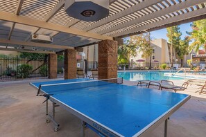Relax by the pool and enjoy a game of ping pong in this outdoor recreational area.
