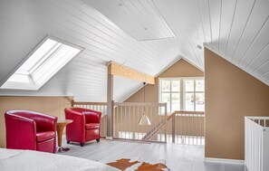 A room with a sloped ceiling, a skylight, a staircase, and a view of the outdoors. - 1 bedroom beautiful home in Skjoldastraumen (Skjoldastraumen)
