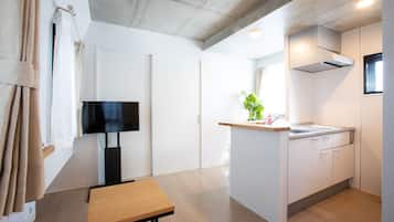 Apartamento familiar (401) | Zona de estar | Una televisión de pantalla plana