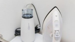 A white iron and a white electric kettle on a white surface. - Viewcity Shinjukugyoen 801-2 (Tokyo)